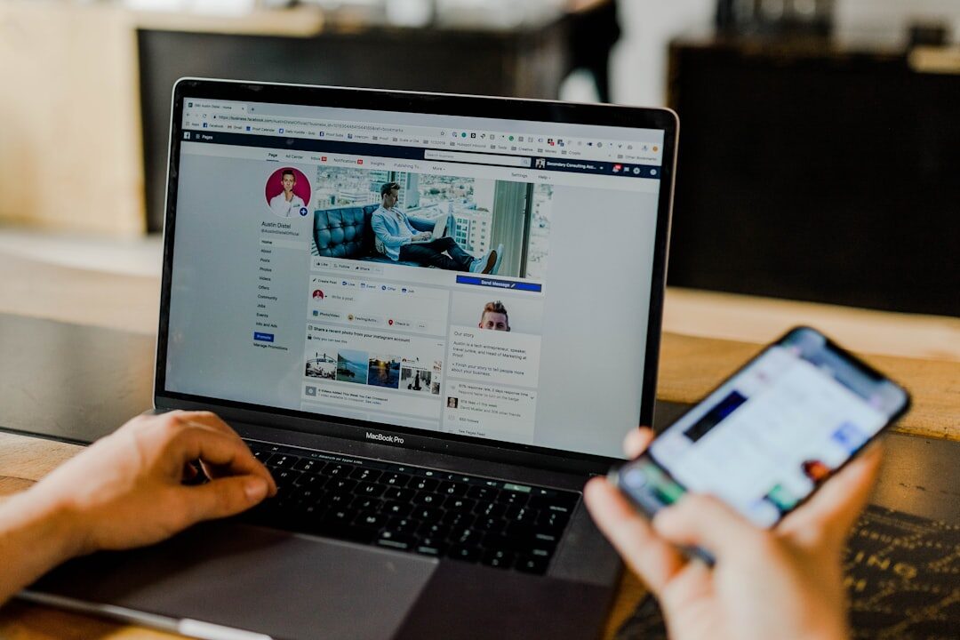 Hands typing on laptop with social media analytics